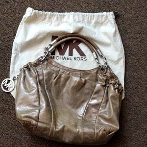 Michael Kors satchel in golden champagne metallic leather. 